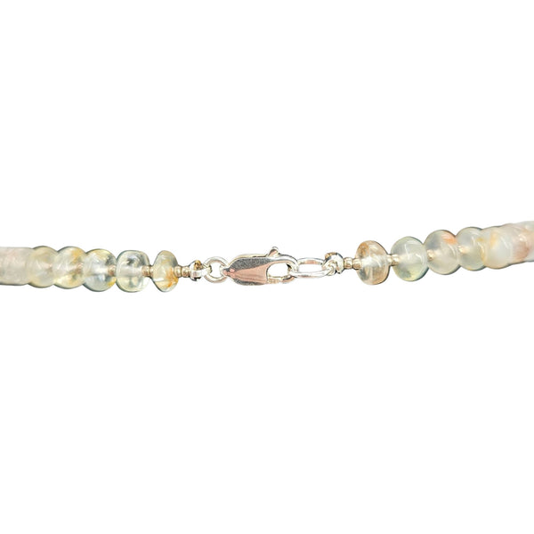 Beaded necklace with pale opal-like beads and silver-tone spring ring clasp