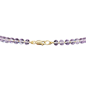 Purple zircon necklace with round stones and gold-tone lobster clasp close-up