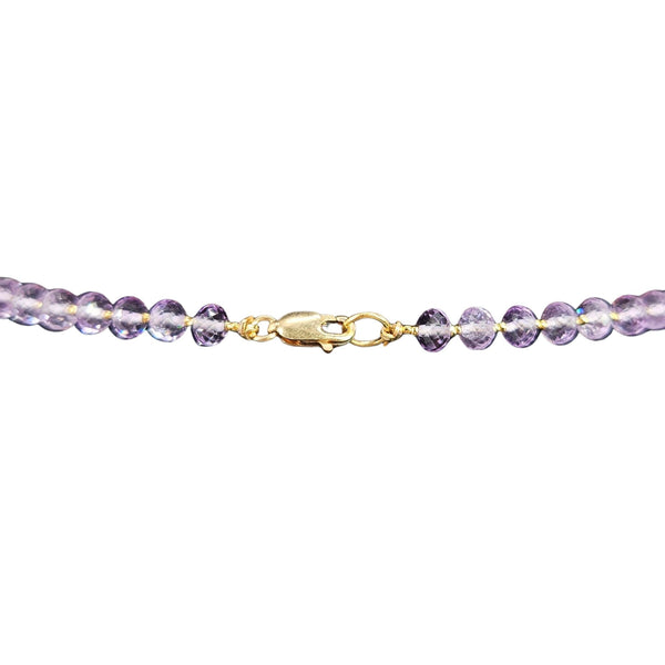 Purple zircon necklace with round stones and gold-tone lobster clasp close-up