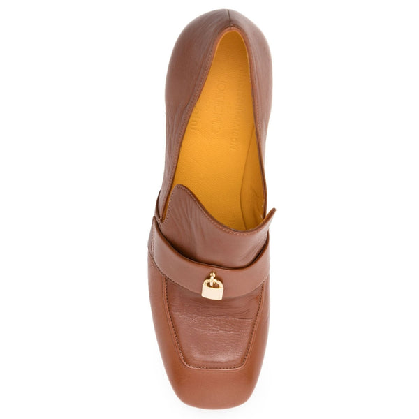 Tan leather loafer with gold lock buckle strap and pointed toe