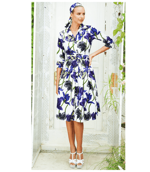 White long dress with blue and purple tulip print, belted waist, button-front collar
