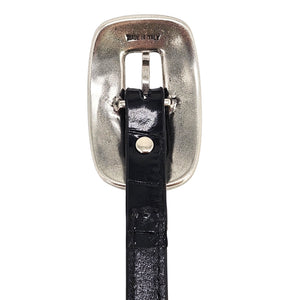 Metal prong buckle and black leather keeper on croc-embossed belt