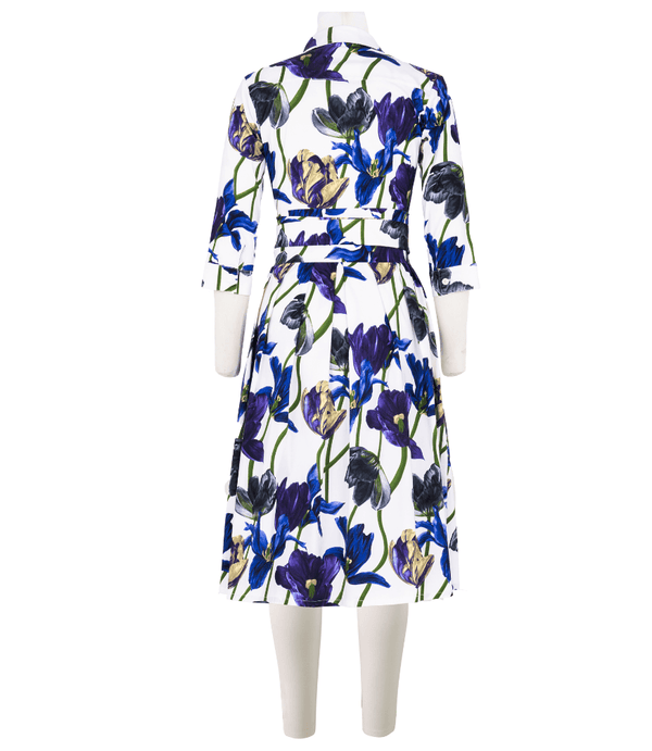 Back view: white tulip-print long dress with belted waist and button collar