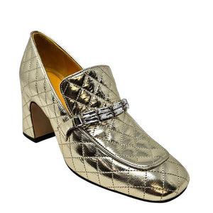 Gold quilted leather loafer with metallic sheen, decorative buckle strap, chunky block heel
