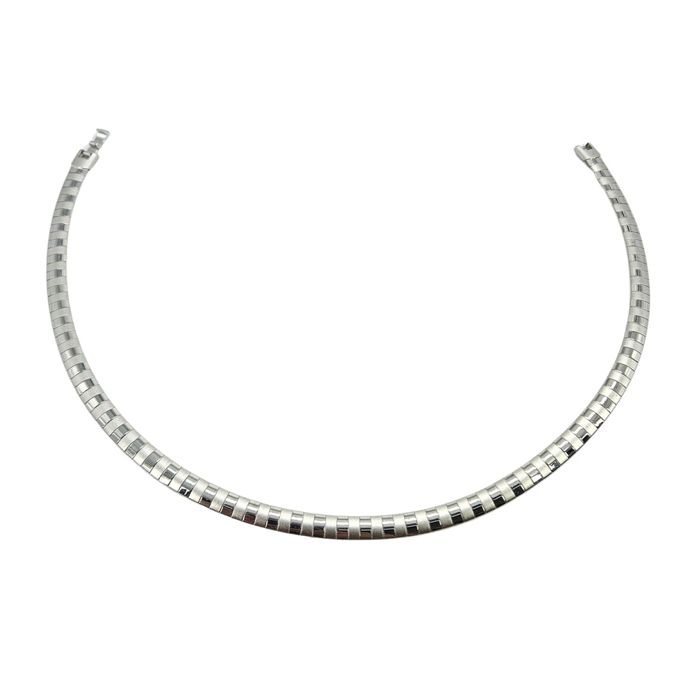Silver collar necklace with alternating ribbed bead segments and square clasp