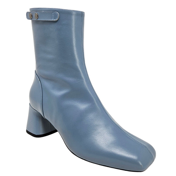 Light blue ankle boot with block heel and rounded toe, side view.