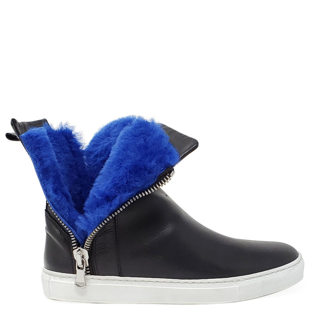 Black leather ankle boot with side zipper, white outsole, and blue shearling lining