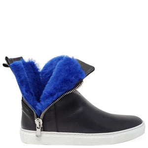 Black leather ankle boot with side zipper and bold blue shearling around the collar