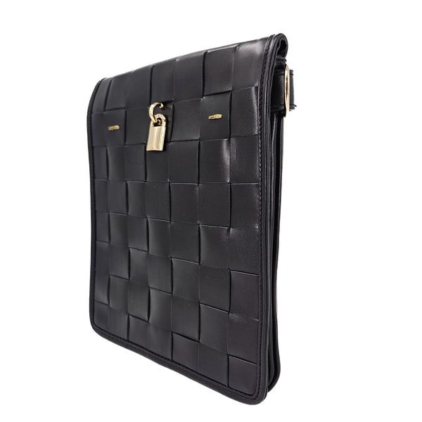 Black woven leather crossbody bag, side view with woven pattern, gold lock clasp, strap loops