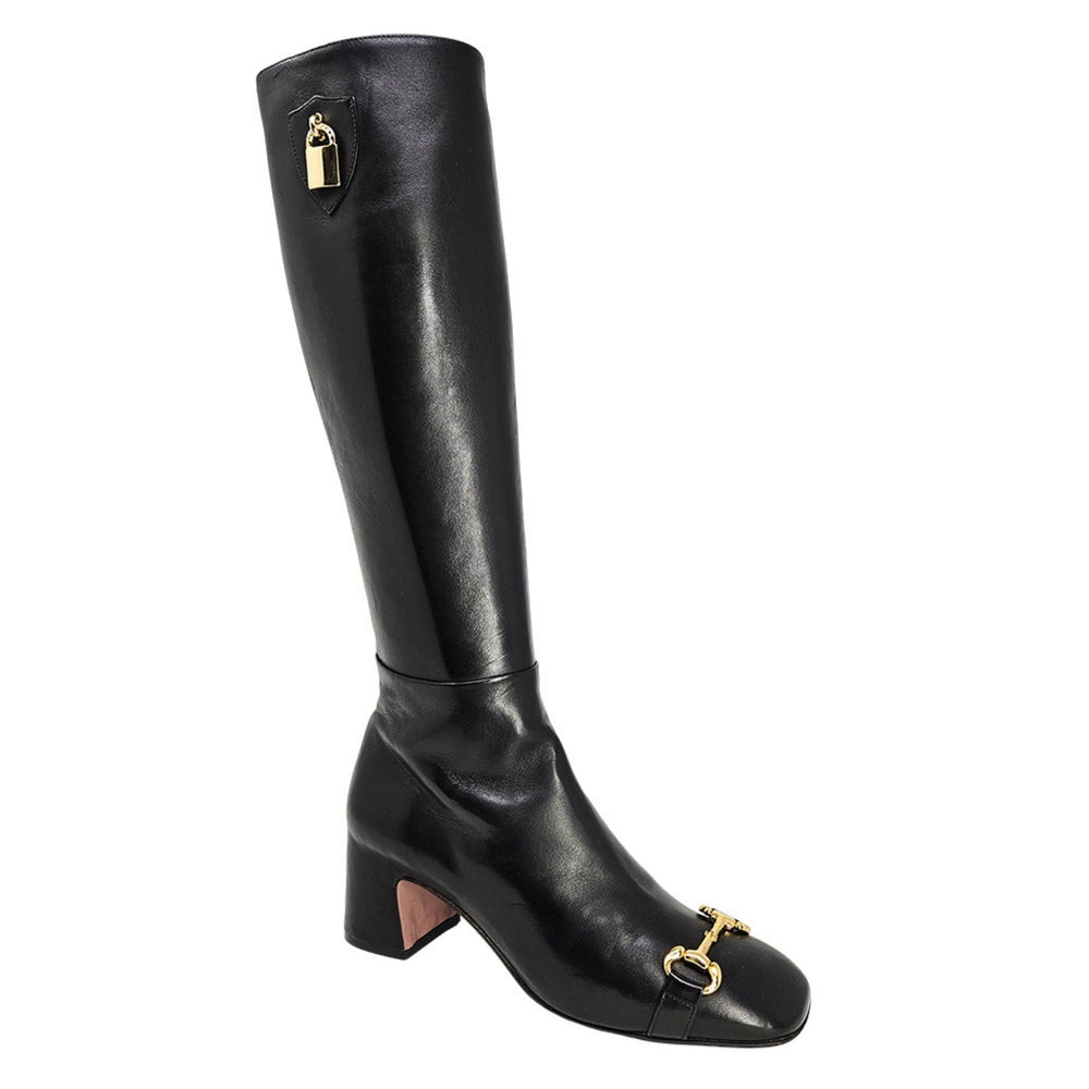 Black tall lock boot with gold lock hardware and low block heel