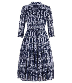 Indigo long-sleeve dress with white chain print, gathered waist, tiered skirt