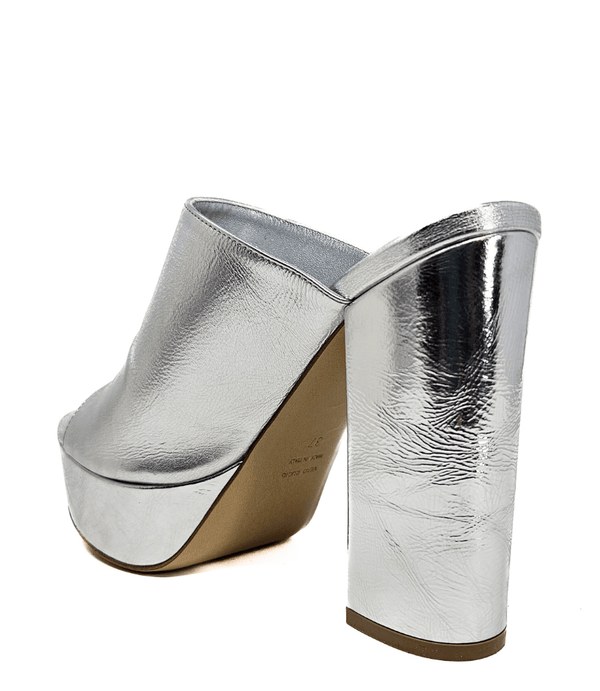 Silver platform slide sandal with open toe and tall sculpted heel.