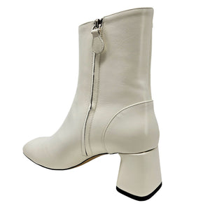 Off-white ankle boot with side zipper, rounded toe, chunky block heel