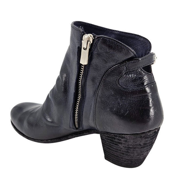 Navy leather ankle boot with exposed side zipper and curved seam, block heel