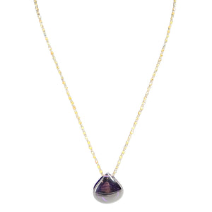 Teardrop pendant necklace featuring a purple gem drop framed in metal on chain
