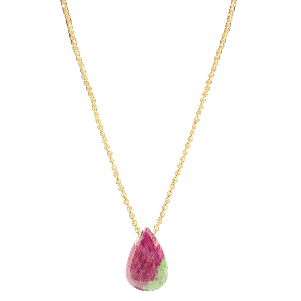 Gold-tone chain necklace with large ruby-red and green teardrop gemstone pendant