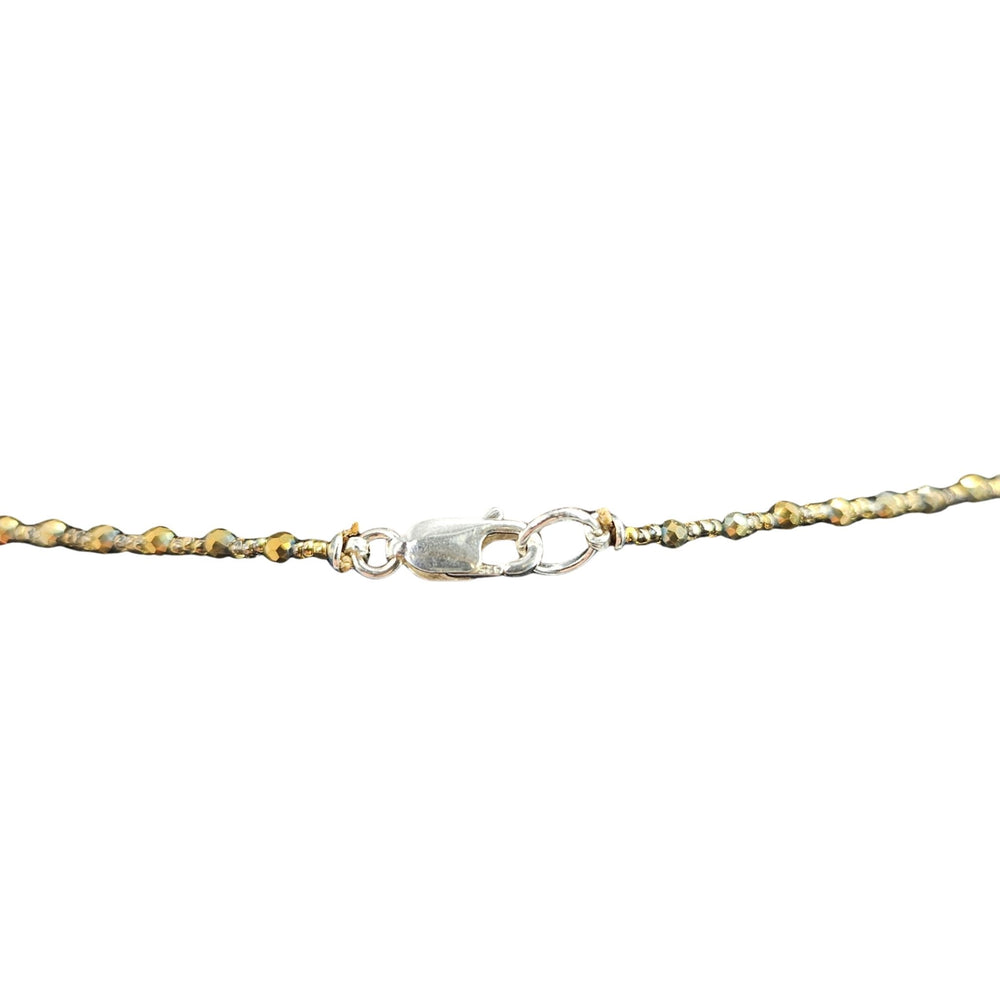 Sage green jade Buddha pendant on gold-tone chain necklace