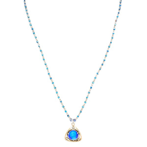 Blue beaded necklace with blue heart pendant and small clear accents