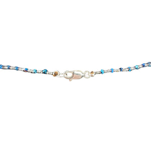 Blue beaded necklace with silver clasp and small extender links