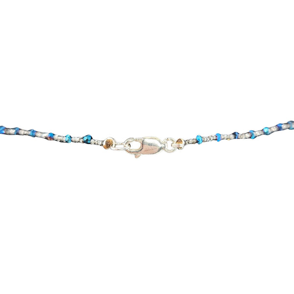 Blue beaded necklace with silver clasp and small extender links