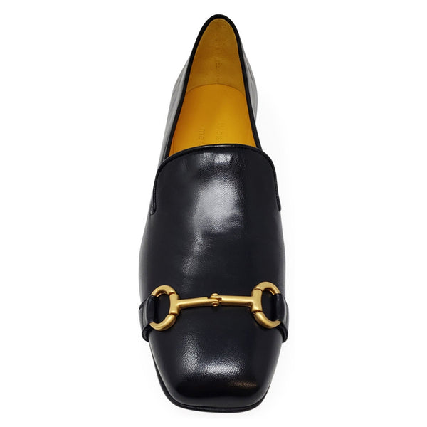 Black leather square-toe loafer with gold horsebit hardware and tan interior lining