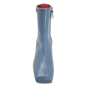 Light blue ankle boot with side zipper and red interior lining, stacked heel.