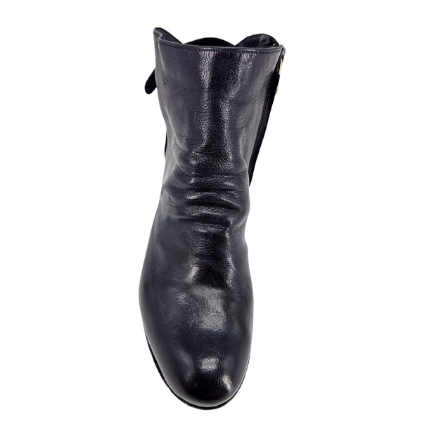 Navy leather ankle boot with pull tab at topline, rounded toe