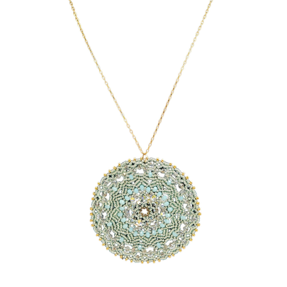 Gold-tone chain necklace with round pale aqua beaded pendant