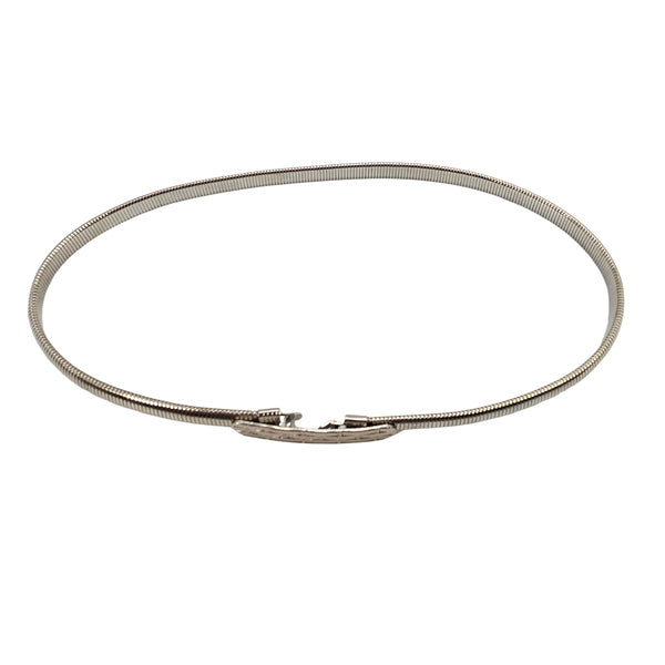 Silver coiled stretch belt with small rectangular buckle at center