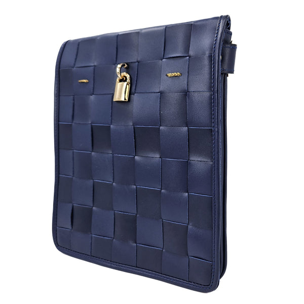 Navy woven leather crossbody bag, side view with gold lock and flap