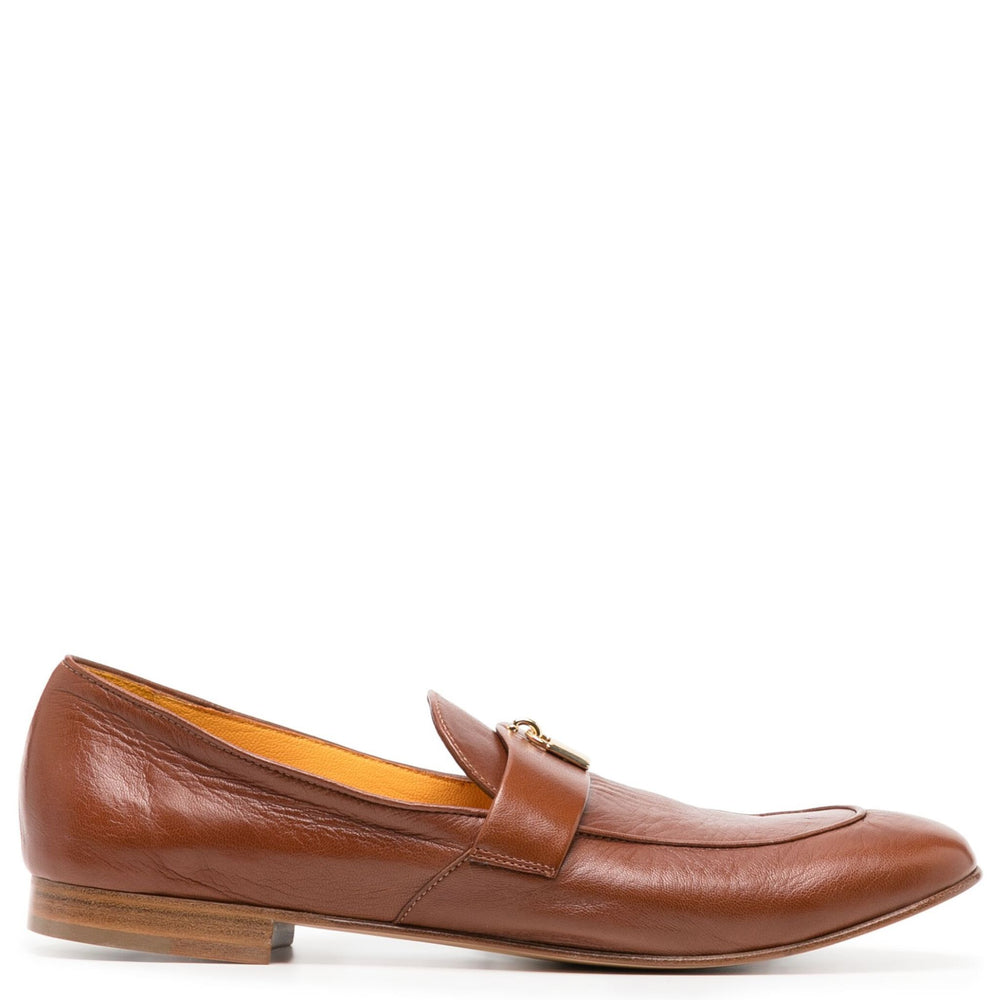 Tan leather flat loafer with lock buckle strap and moc toe stitching