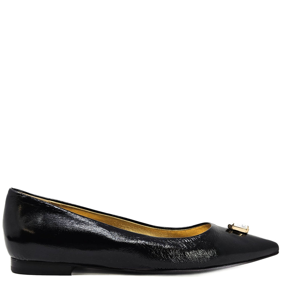 Black pointed ballet flats with gold buckle and jewel detail at vamp