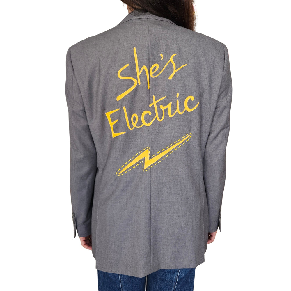 Grey blazer with back graphic text and lightning bolt, long sleeves
