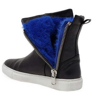 Black leather ankle boot with side zipper and thick blue shearling panel across the top