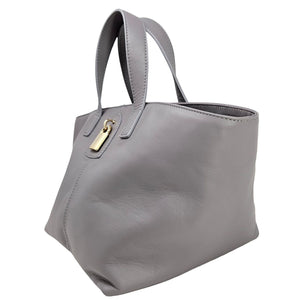 Light grey leather tote bag with side lock strap and structured open top