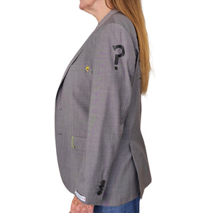 Grey blazer side view with question-mark patch and flap pockets