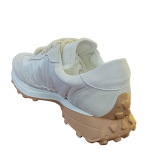 Light blue jogger sneaker side view with blue star and chunky rubber outsole