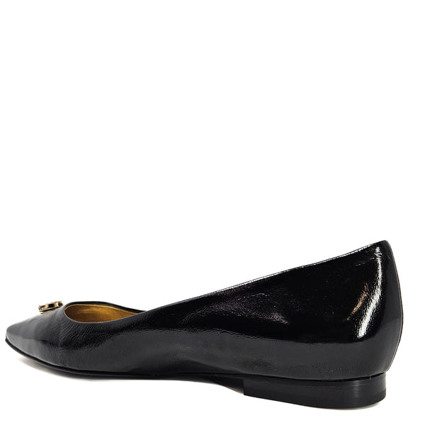 Black pointed ballet flats with glossy finish, low heel, and jewel buckle detail