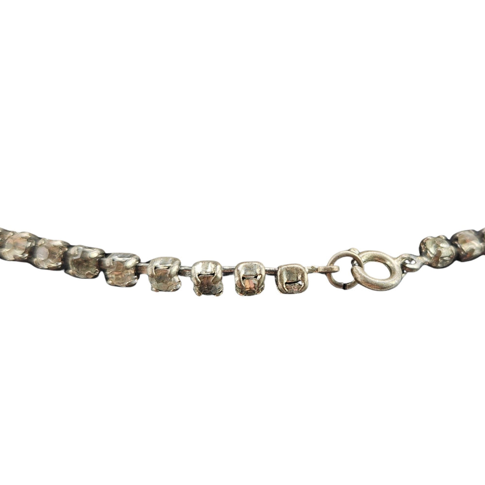 Blue faceted rhinestone necklace with linked rows and scalloped curve