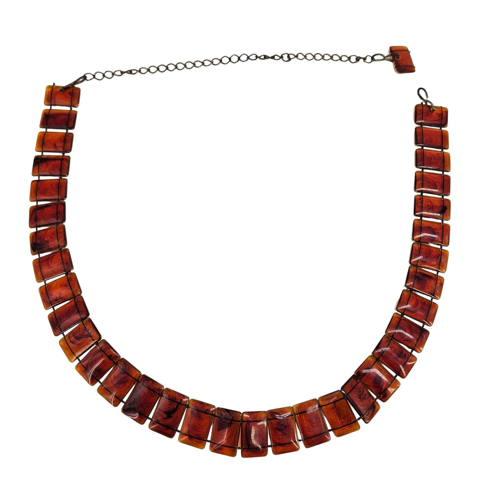 Tortoise-brown vintage link belt with rectangular celluloid-style panels and chain ties