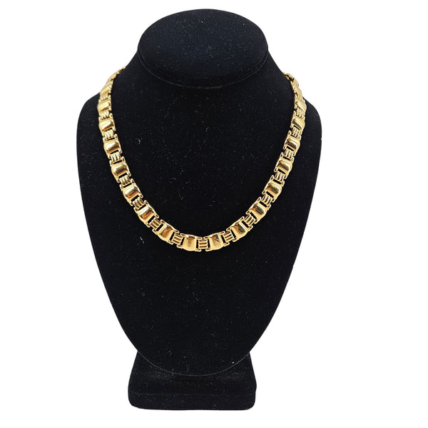 Gold-tone link collar necklace with repeating rectangular chain links, choker length