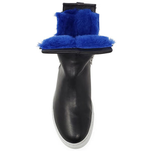 Black leather ankle boot back view with blue shearling cuff and white rubber sole