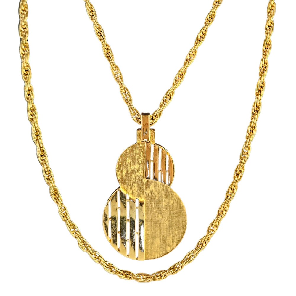 Gold-tone pendant necklace with stacked round cutout discs and linked chain