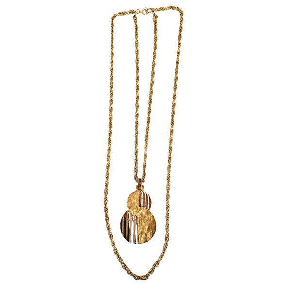 Gold-tone pendant necklace with layered chain and dangling round bar-cutout pendant