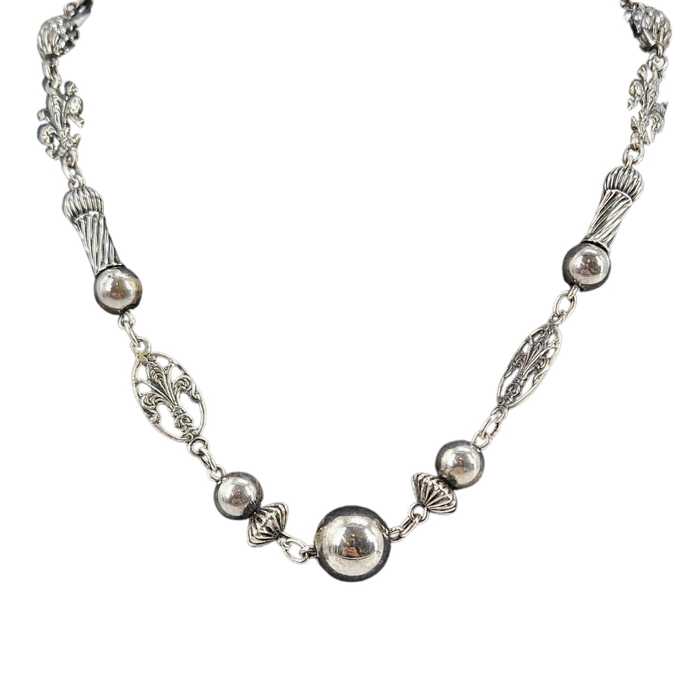 Sterling silver fleur-de-lis station necklace with round bead links and chain segments