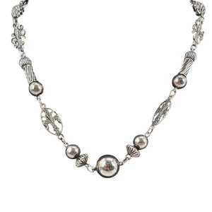 Sterling silver fleur-de-lis station necklace with round bead links and chain segments