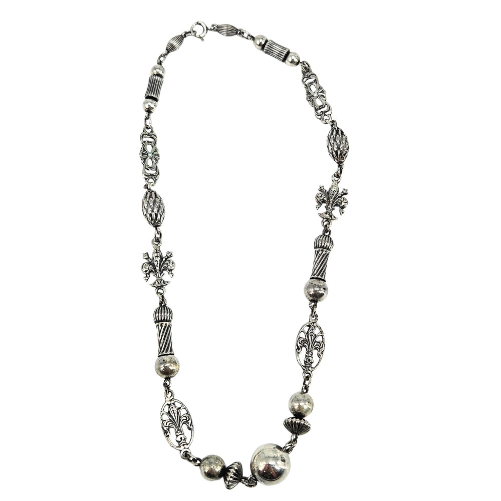 Sterling silver fleur-de-lis station necklace with round bead links and chain segments