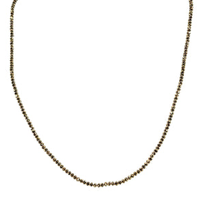 Bronze beaded necklace with small round pyrite-style beads along the curve