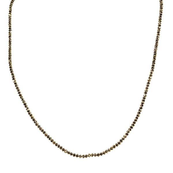 Bronze beaded necklace with small round pyrite-style beads along the curve