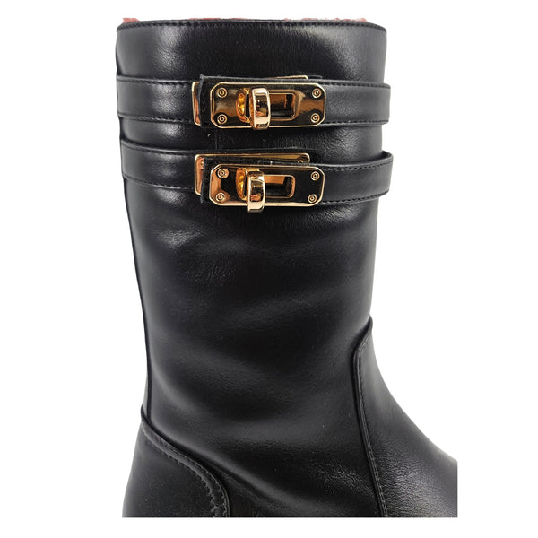 Black boot shaft with two buckle straps in gold-tone hardware.
